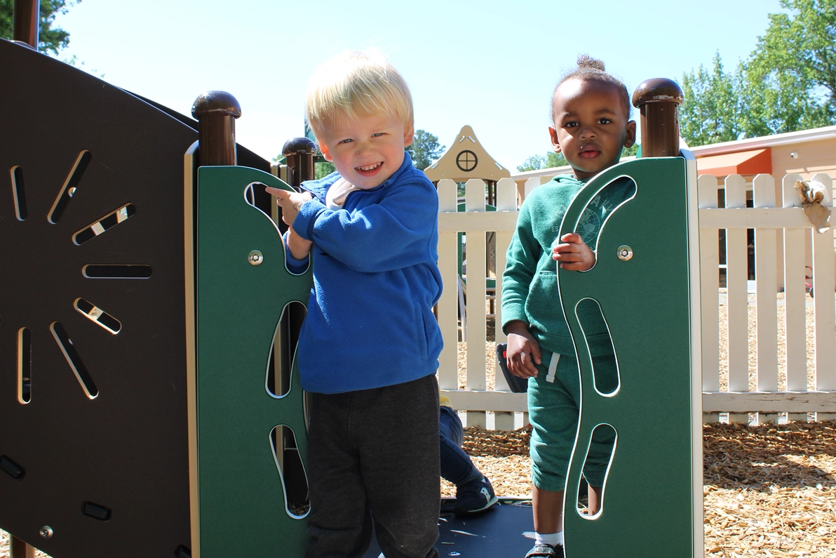 kids on playset -Raleigh Glenwood daycare SPANISH FOR FUN