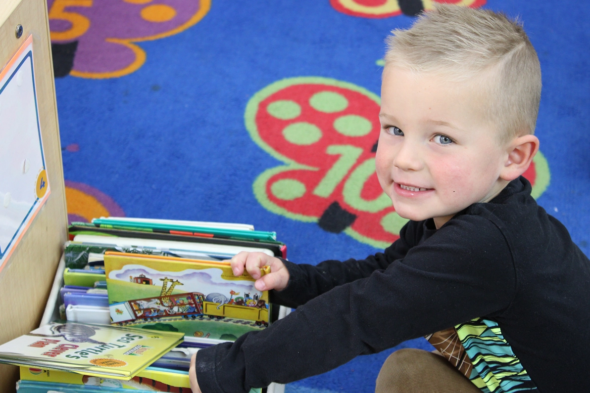 reading books in school - Raleigh Glenwood daycare SPANISH FOR FUN